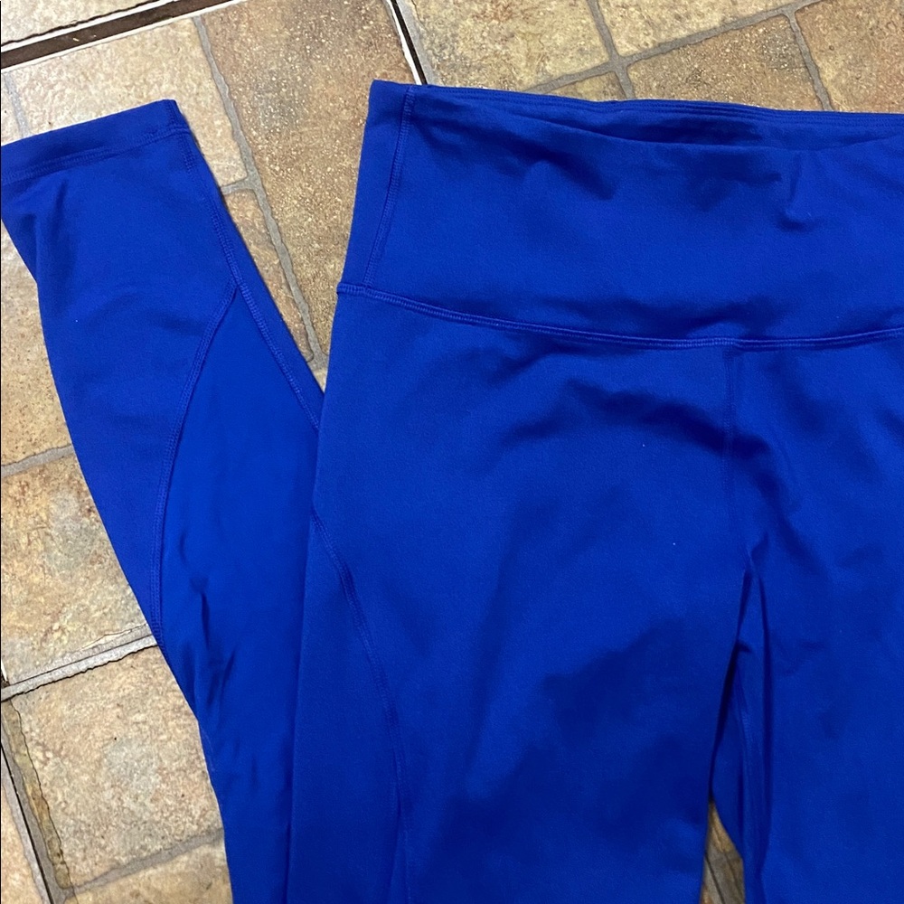 Blue Leggings. TALL size Large. Waist pocket. Great for running